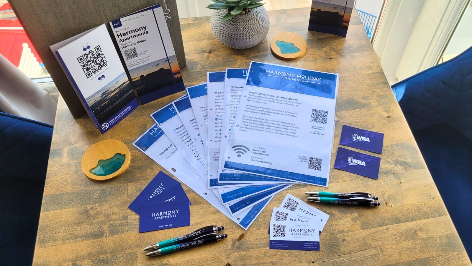 Branded business cards, pens and QR welcome cards for Harmony Apartments