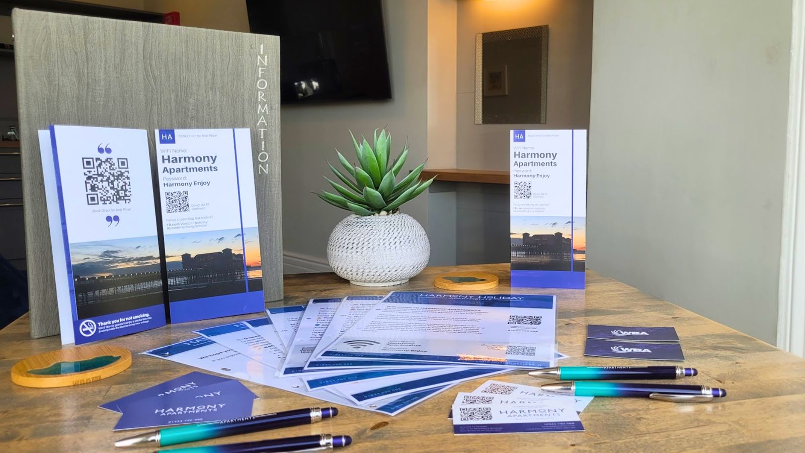 Guest information folders and table talkers for Harmony Apartments